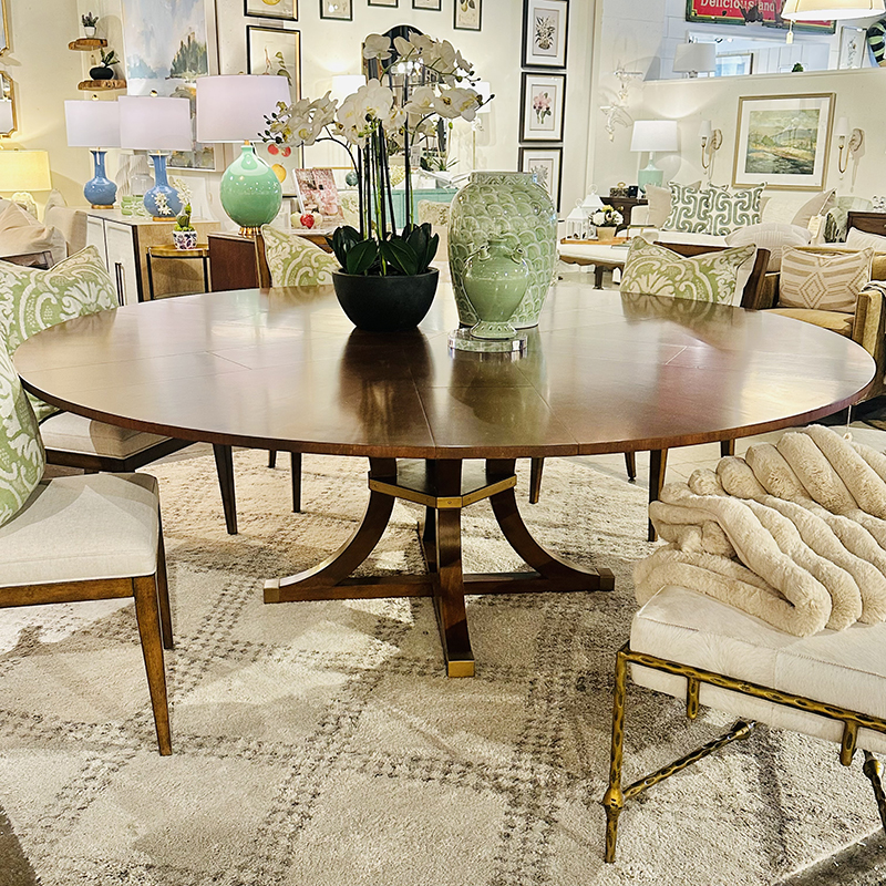 Jupe extension round dining table with brass detail